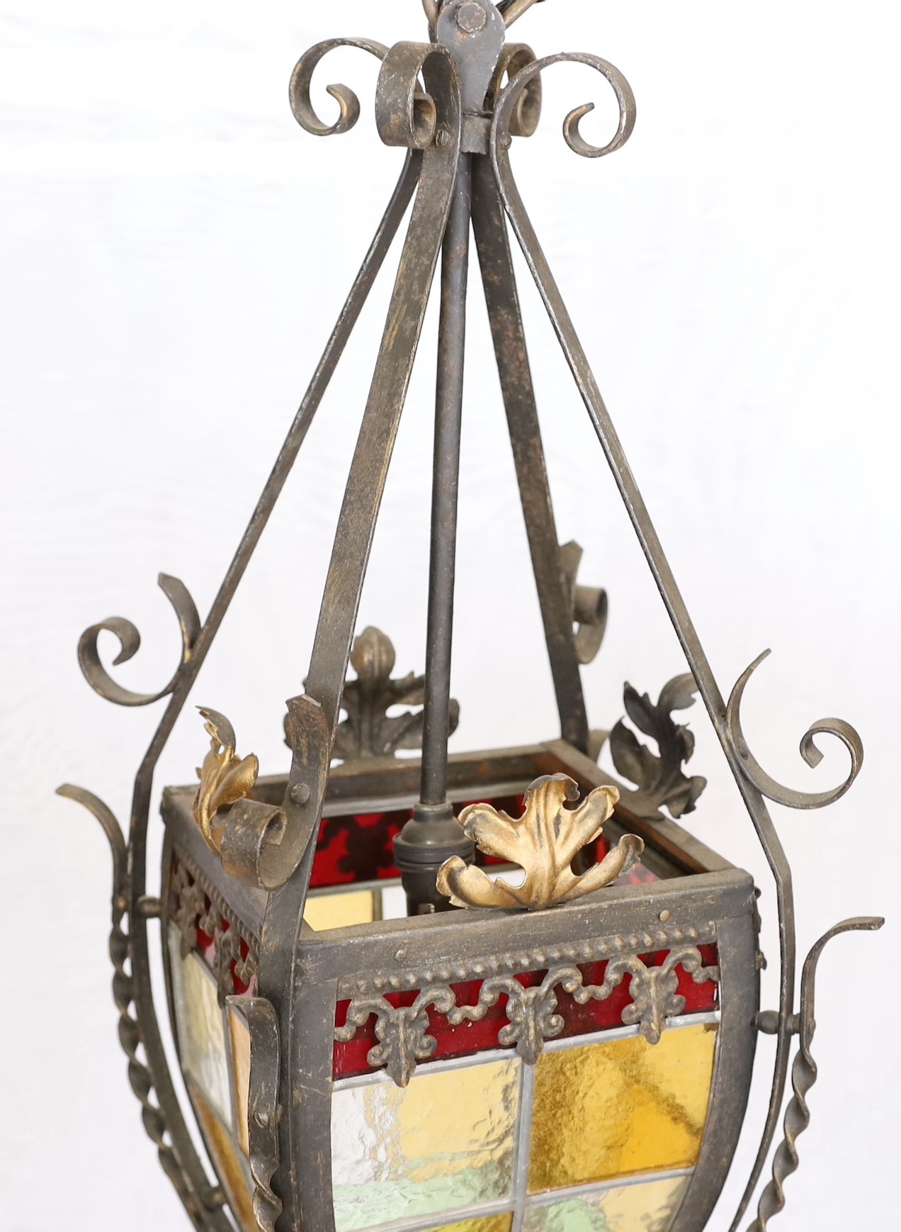 A 1940s-50s French wrought iron and stained glass hall lantern, height 60cm. width 28cm